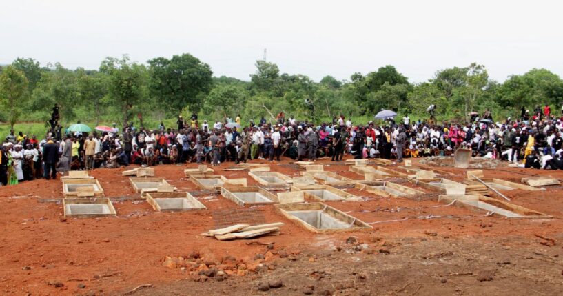The graves of 17 Christian worshippers and two priests who were murdered by Fulani herdsmen sit open in north-central Nigeria on May 22, 2018.