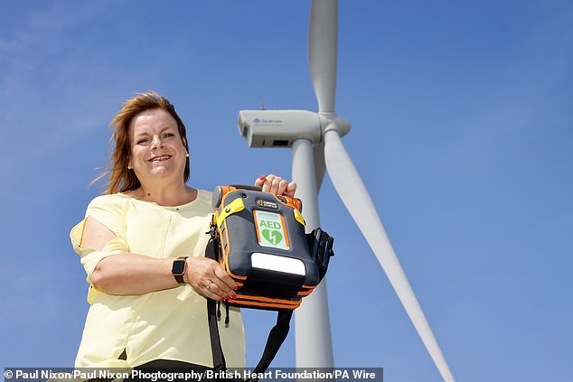 A stone's throw from Ness Point in Lowestoft, Suffolk, is the country's most easterly defib. In a carpet shop next to the sea, this defibrillator is closer to Amsterdam than it is to Birmingham. Pictured is Guardian Jayne Biggs who has two of her 182 defibrillators featured in this list.