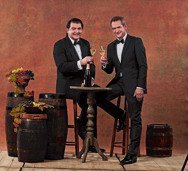 Actor Alexander Armstrong (right) and wine critic Matthew Jukes (left) smile for the camera at a photoshoot in London's Holborn Studios in November 2018