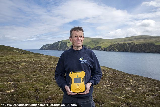Located further north than Oslo, Norway, the defibrillator at Hermaness National Nature Reserve on Unst in Shetland, takes the crown for being the most northerly defibrillator in the UK. Pictured with dedicated defib guardian Juan Brown - operations officer at NatureScot.