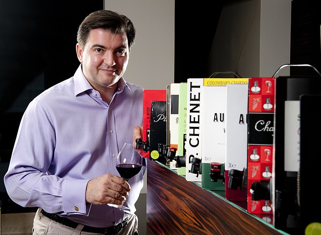 Jukes was passionate about wine but never pretentious - Richard Kay remembers him devoting one column to the perfection of wine in a box. Pictured: Matthew posing with ten box wines at his home in Battersea, London