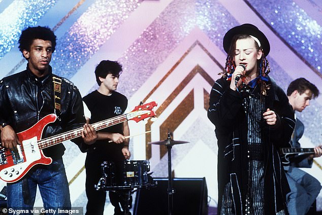 George sings alongside his Culture Club bandmates during the 1980s, a decade of major success for the band