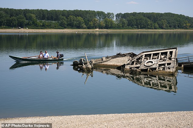 The wreckage of a WWII German warship, emerged due to the drought, in front of Djerdap II, a large dam on the Danube River, between Romania and Serbia, near Prahovo, Serbia, August 4, 2026