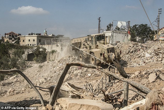 A Lebanese army bulldozer removes the rubble following Israeli military operations in the southern Lebanese village of Zawtar al-Gharbiyah on August 8, 2026. Israel refused in talks on August 6, to withdraw from more areas of south Lebanon unless the Lebanese army had full control of an initial two "pilot zones"