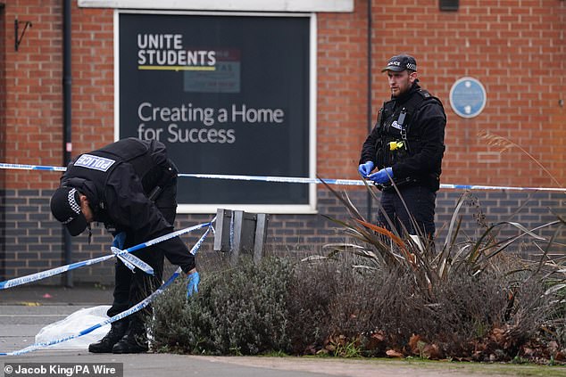 Police search near the scene at the campus of De Montfort University in Leicester
