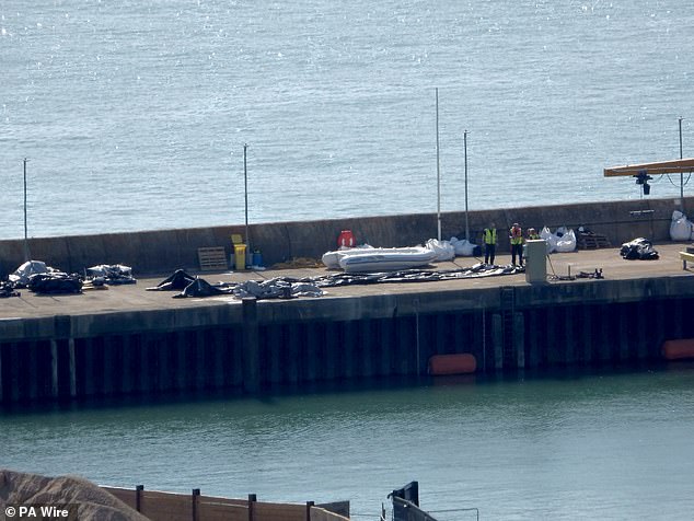The mega-dinghy that reached Britain overnight with 230 migrants on board is pictured in Dover today