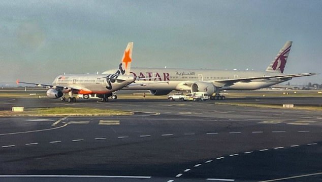 Two airport workers stood down after two planes almost collide at Sydney Airport
