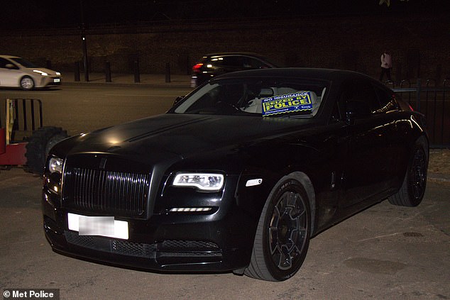 A Rolls-Royce Wraith apprehended by Metropolitan Police officers in a crackdown on anti-social behaviour