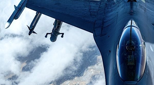 An F-16 Fighting Falcon, assigned to the 64th Aggressor Squadron, receives fuel from a KC-135 Stratotanker assigned to the 91st Air Refueling Squadron, MacDill Air Force Base, Florida, while participating in Red Flag-Nellis 22-2 over the Nevada Test and Training Range, Nevada, March 16, 2022. (U.S. Air Force photo by Airman 1st Class Josey Blades)