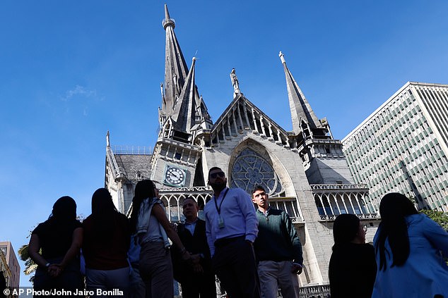 Residents stand outside the Cathedral of Manizales after it was damaged by an earthquake in Manizales, Colombia, Monday, August 10 2026