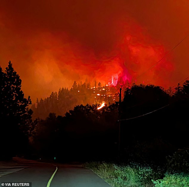 Raging wildfire that erupted 'like a bomb' causes 20,000 Canadians to flee their homes as inferno sweeps parched land