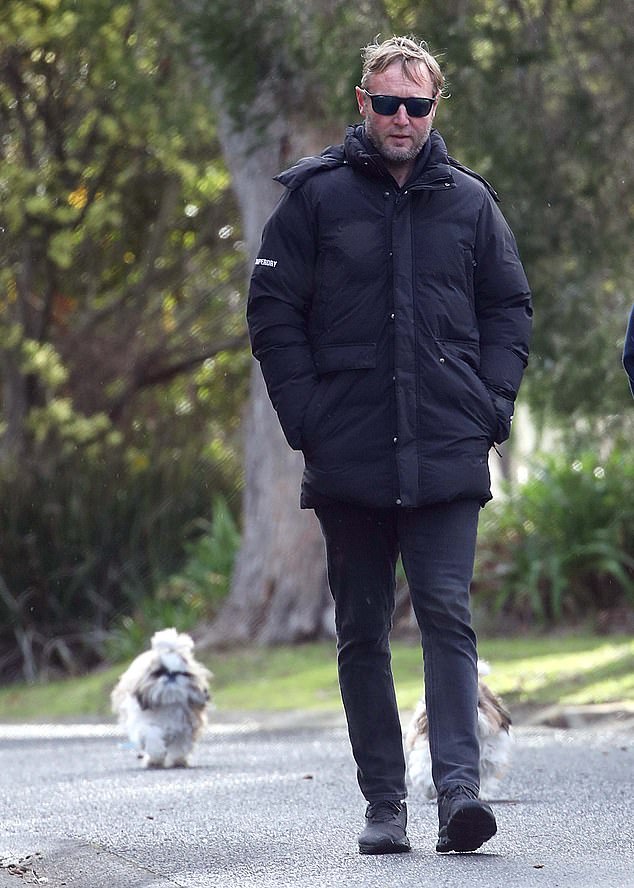 David Anderson (pictured) - a director of collapsed financial group First Guardian - is seen above during a peaceful stroll on Phillip Island last year