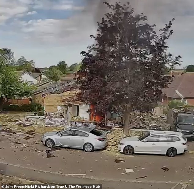 Plumes of black smoke were seen rising from the property as locals approached the wreckage following the blast
