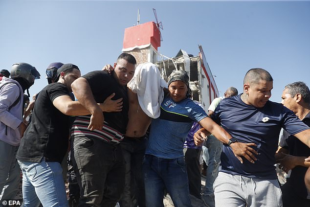 People are being evacuated from a collapsed building after an earthquake in Cali, Colombia, August 10 2026