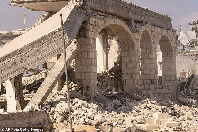 A Lebanese army soldier inspects destruction of a home by the Israeli military in the southern Lebanese village of Zawtar al-Gharbiyah on August 8, 2026