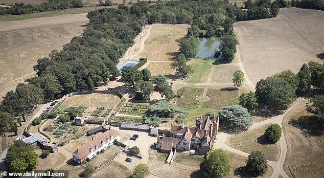 Chef Jamie Oliver's lawns are rather more green than most - helped by having a large personal lake just a stone's throw from the back of his Essex mansion