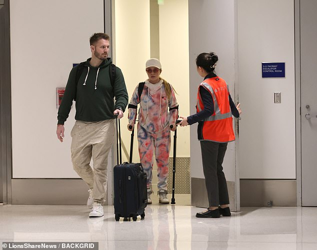Panettiere previously relied on crutches for help walking as she struggled with a painful back injury. She is pictured hobbling at LAX with ex-boyfriend Brian Hickerson in March
