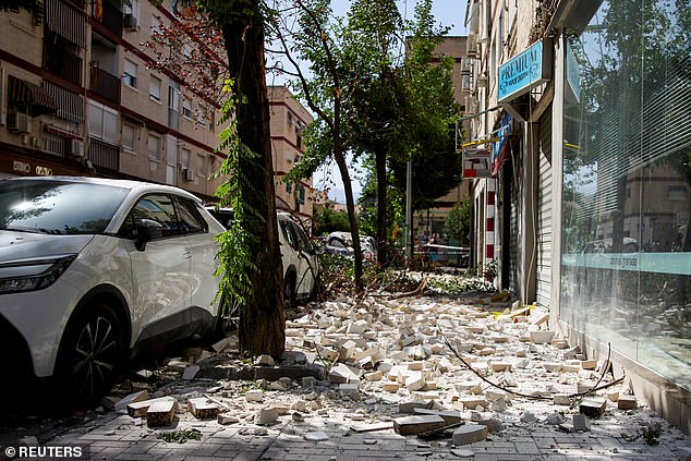 Debris lies scattered on a street in Granada in the aftermath of the quake