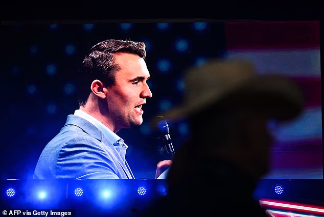 Attendees watch a video showing slain activist Charlie Kirk, on the first anniversary of Kirk's assassination on September 10