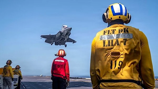 U.S. Sailors observe as a Marine Corps F-35B stealth fighter lands on the flight deck of USS Tripoli (LHA 7) while transiting the Arabian Sea on Saturday, May 30, 2026. (U.S. Central Command photo)