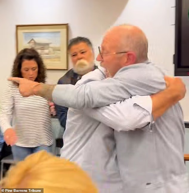 Another angle captured by the township's own livestream showed the mayor and the man trading words across the room as others spoke
