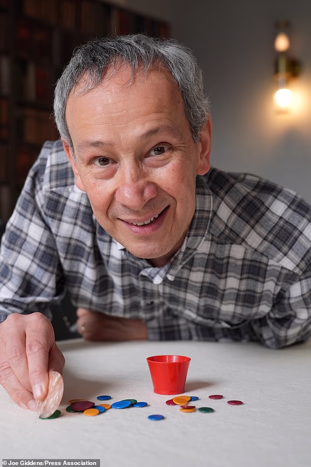 Can he flick it? Yes he can! Cambridge professor lands 12th Tiddlywinks world title after 7-hour epic against American challenger