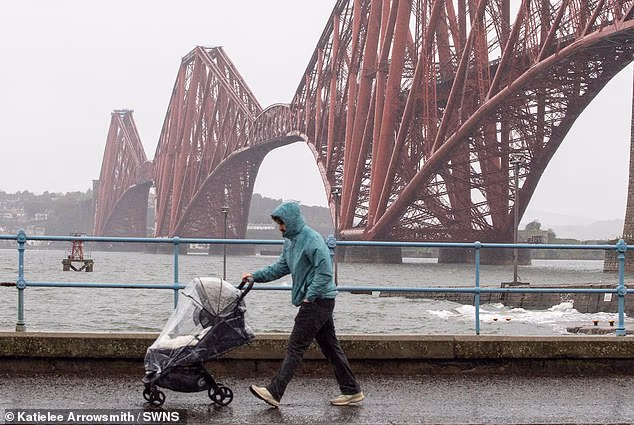 Scotland hit with 'biblical' downpours as Storm Boelo looks set to bring even more miserable weather as Met Office issues 'danger to life' warning