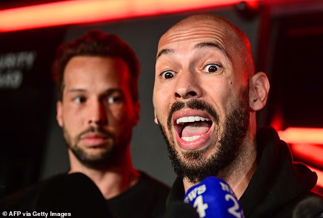 Andrew Tate's lawyer claims the former kickboxer has lost weight behind bars and is now suffering from an undisclosed illness. Andrew Tate is seen with his brother Tristan behind him