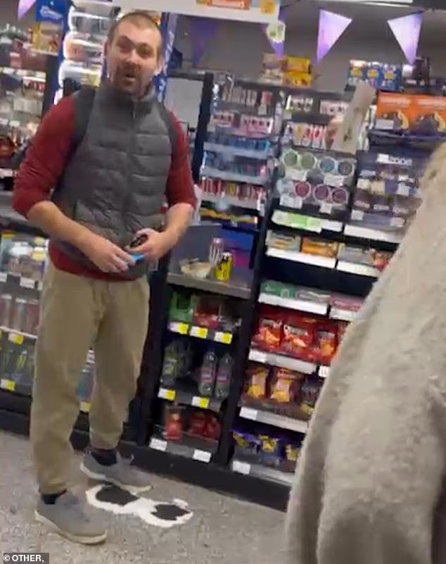 Shocking moment man racially abuses black woman yelling 'get back on your boat' in convenience store - then walks out without paying