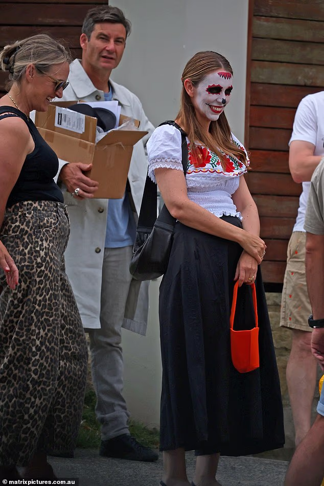 Ardern's husband Clarke Gayford closely followed with his own outfit in tow