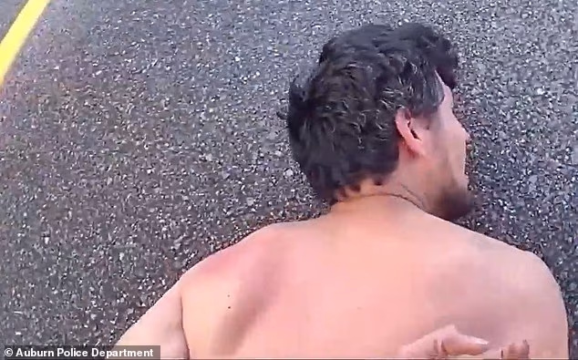 Valles is pinned face down on the road after Bryant fires his Taser and attempts to handcuff him, but police say the suspect continued to struggle and resist arrest