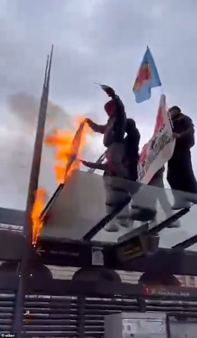 Protesters were seen stamping on US and Israeli flags before setting them alight