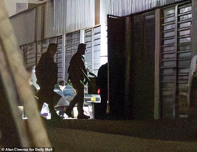 Mexican Guardia Nacional sex crimes investigators are seen raiding Thomas Markle's storage locker in Rosarito, Mexico, on Saturday morning, hours after the Daily Mail reported that it contained child pornography