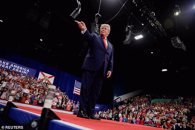 US President Donald Trump points a finger as he arrives to deliver remarks during a midterm campaign rally at Ocean Center in Daytona Beach, Florida, US, October 30, 2026