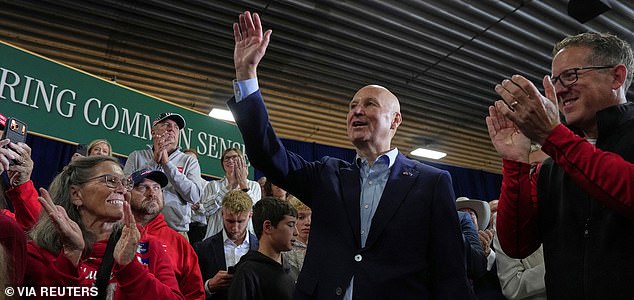 Senator Pete Ricketts, (R-NE), waves to supporters as Vice President JD Vance speaks during a campaign rally at the D&N Event Center in North Platte, Nebaska, US, October 22, 2026.  Jacquelyn Martin/Pool via REUTERS