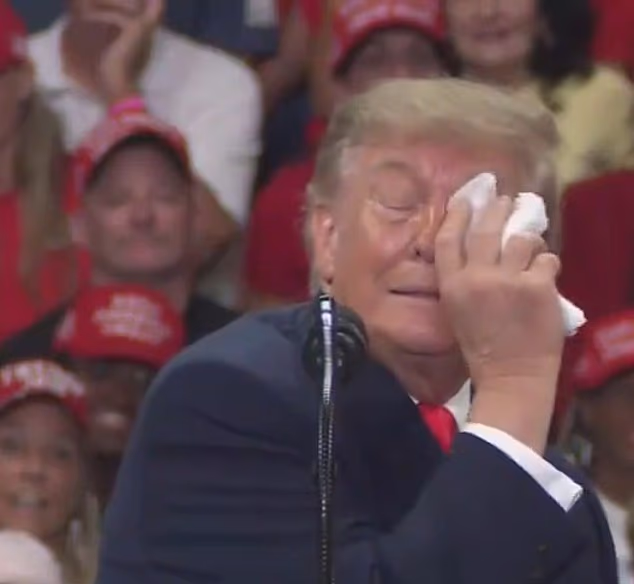 President Donald Trump wiped his eye with a napkin at his Florida rally on Friday