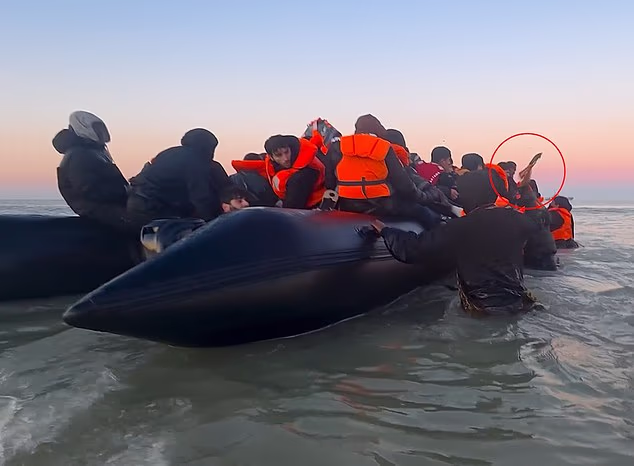 A migrant attempting to cross the Channel appeared to threaten a man with a knife