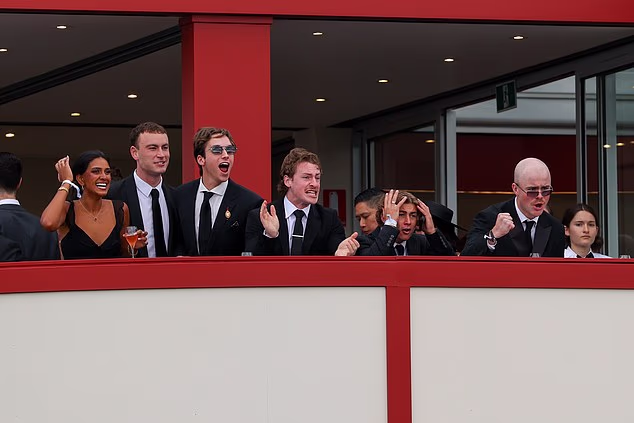 Punters cheering on their favourite horses