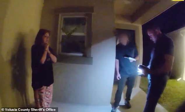 After being alerted to the alleged threat by the Secret Service, Volusia County deputies went to Albro's home where she broke down in tears, insisting her words were intended as a joke (interaction pictured)