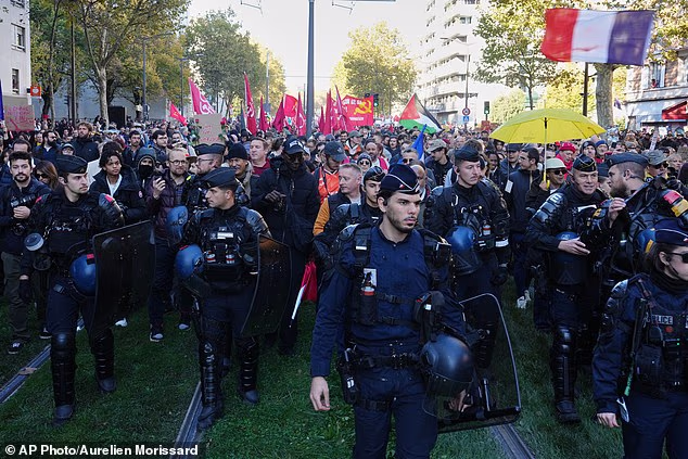French police officers patrol ahead of a demonstration on Saturday where disorder is expected